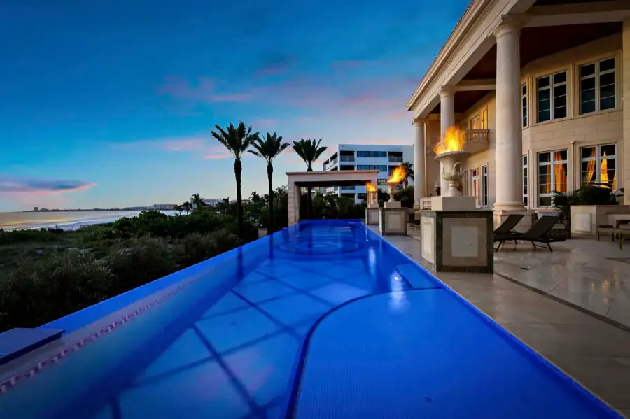 Infinity pool in Tampa with breathtaking ocean views, creating a serene setting for relaxation and leisure.