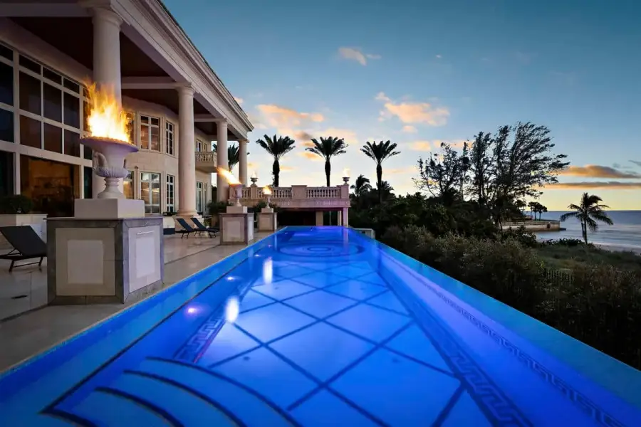 Luxury pool in Tampa with sheltered lounge area and LED lights, providing a private escape with a modern touch.