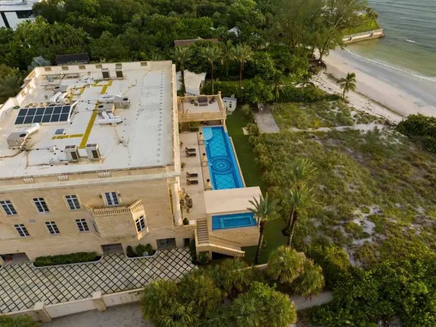 Overhead shot of a luxury pool in Tampa with large water features and expansive sundeck ideal for backyard entertainment
