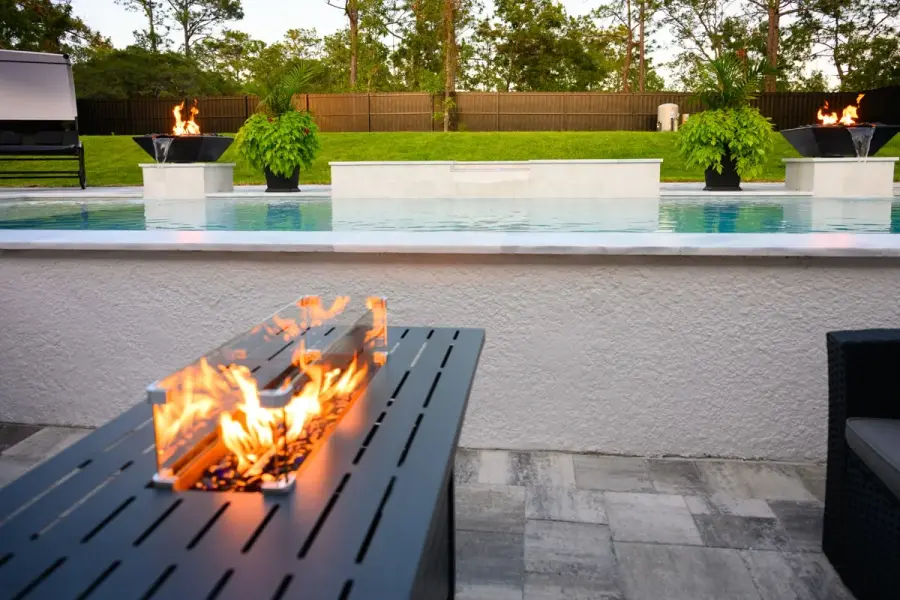 Poolside view featuring a firepit