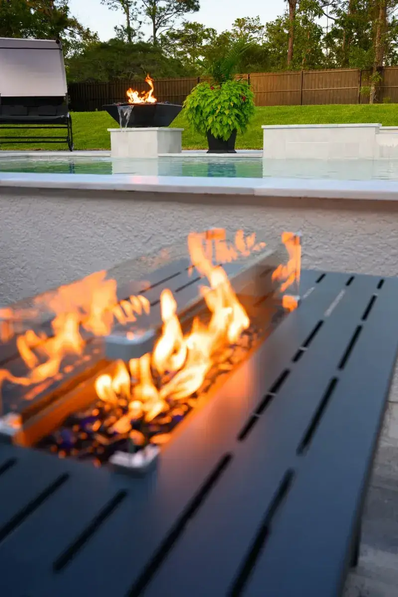 Fire pit beside a custom pool