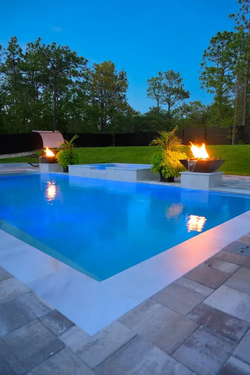 Poolside view with a fire water bowl, showcasing a harmonious blend of fire and water elements