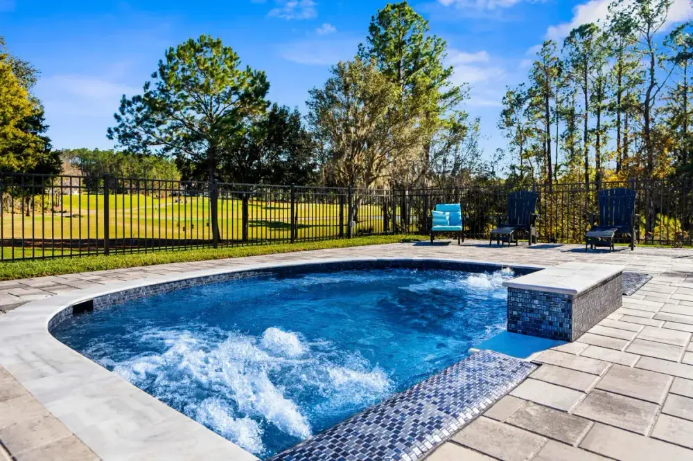 High End Pool Design with Premium Tile and Spa Integration